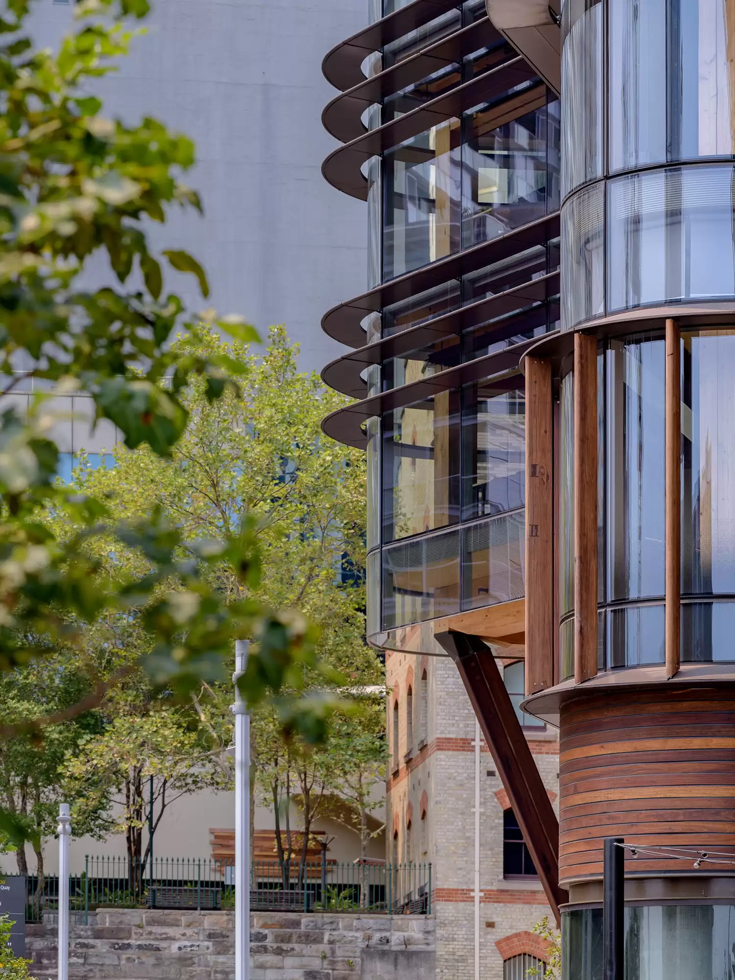 Photograph of sculpted curtain wall façade at northern end of Daramu House which signals the gateway condition at the northern end of the Barangaroo Precinct on Hickson Road