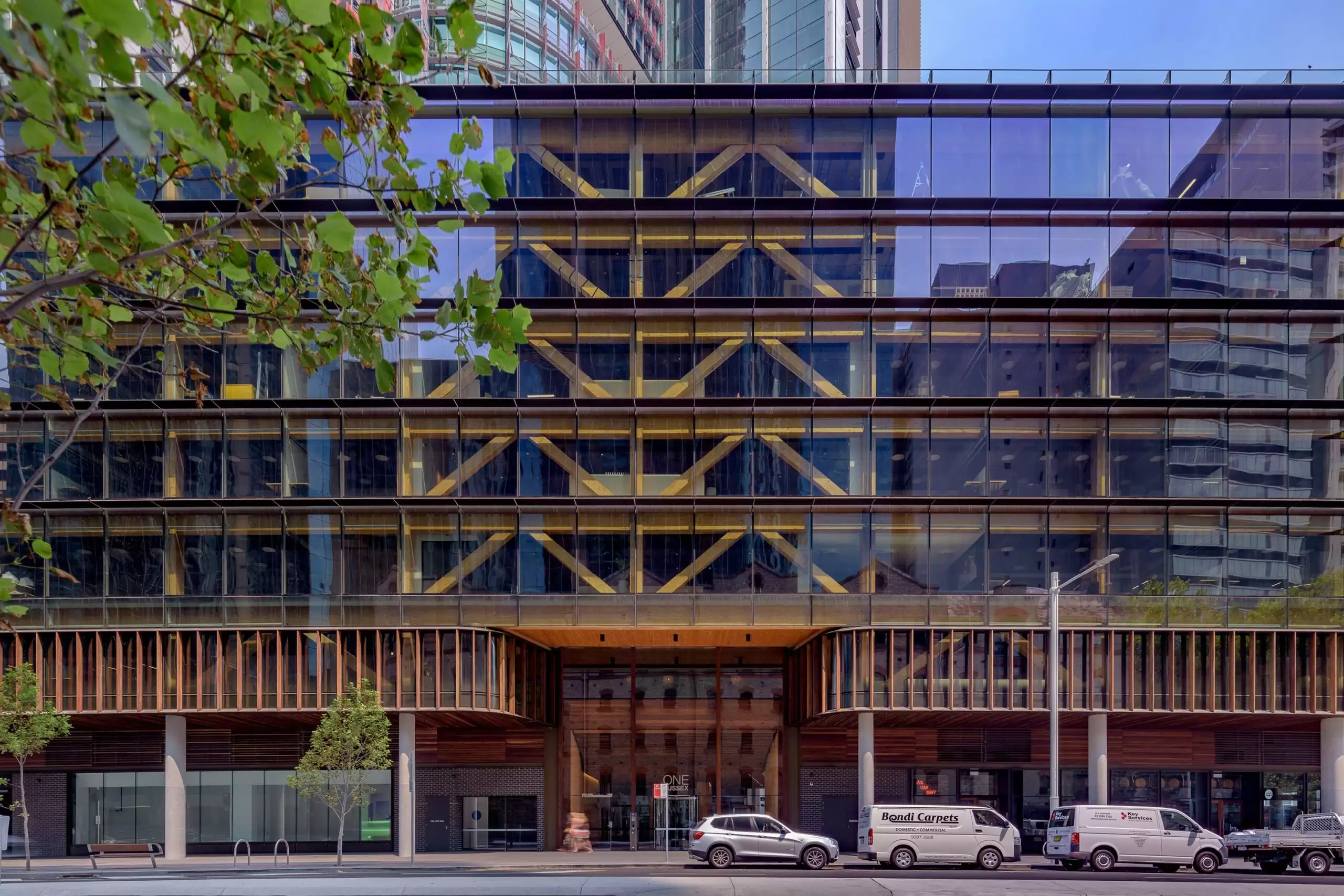 Photograph showing 5 storey timber truss on eastern façade and entrance lobby of the award-wining Daramu House Designed by Tzannes