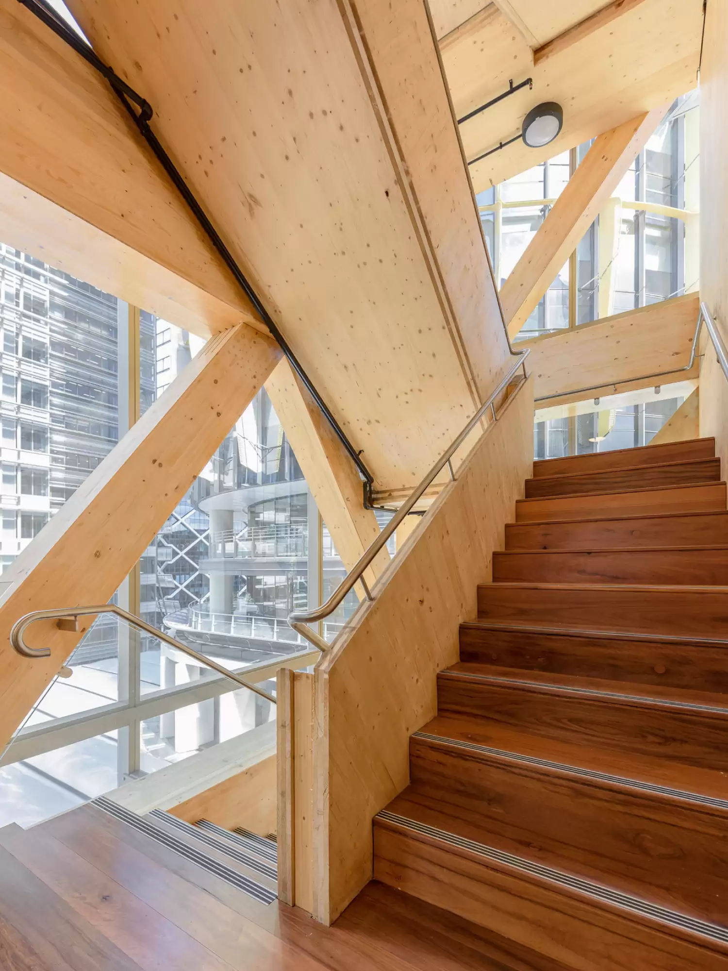 Photograph of exposed timber fire stair which also serves as intertenancy stair