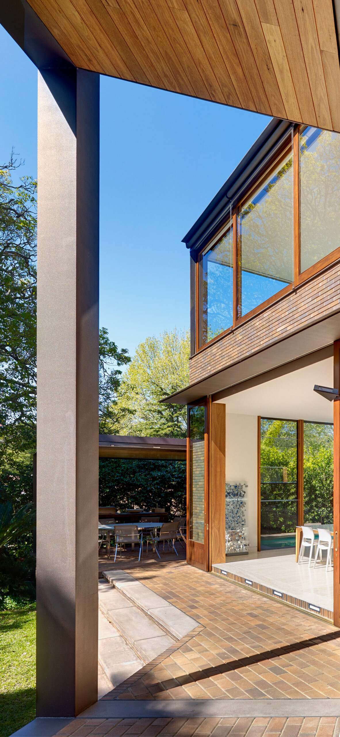 Photograph looking to dining space from verandah in the Garden House designed by Tzannes