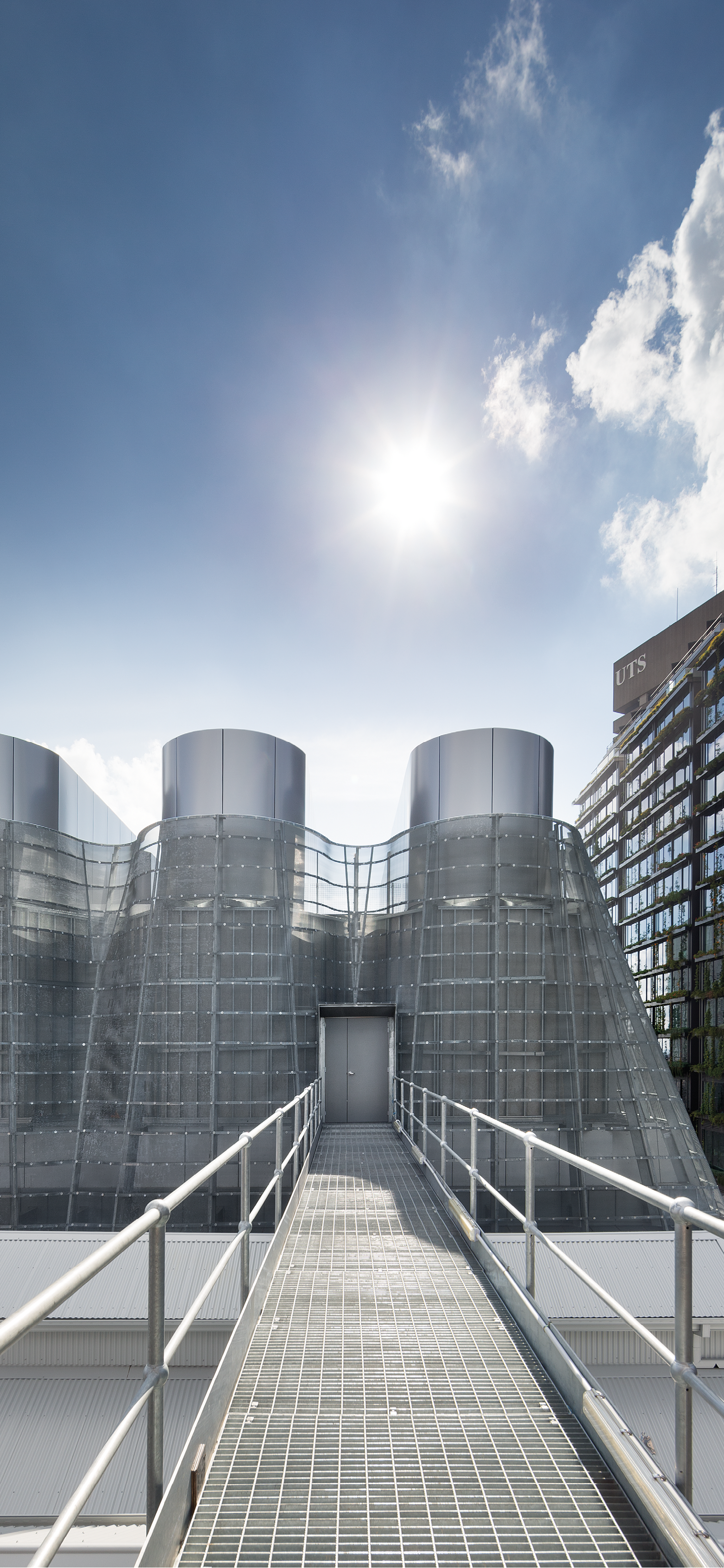 Photograph of the bridge leading to the expressive roof enclosure of the trigeneration plant designed by Tzannes for the Brewery Yard