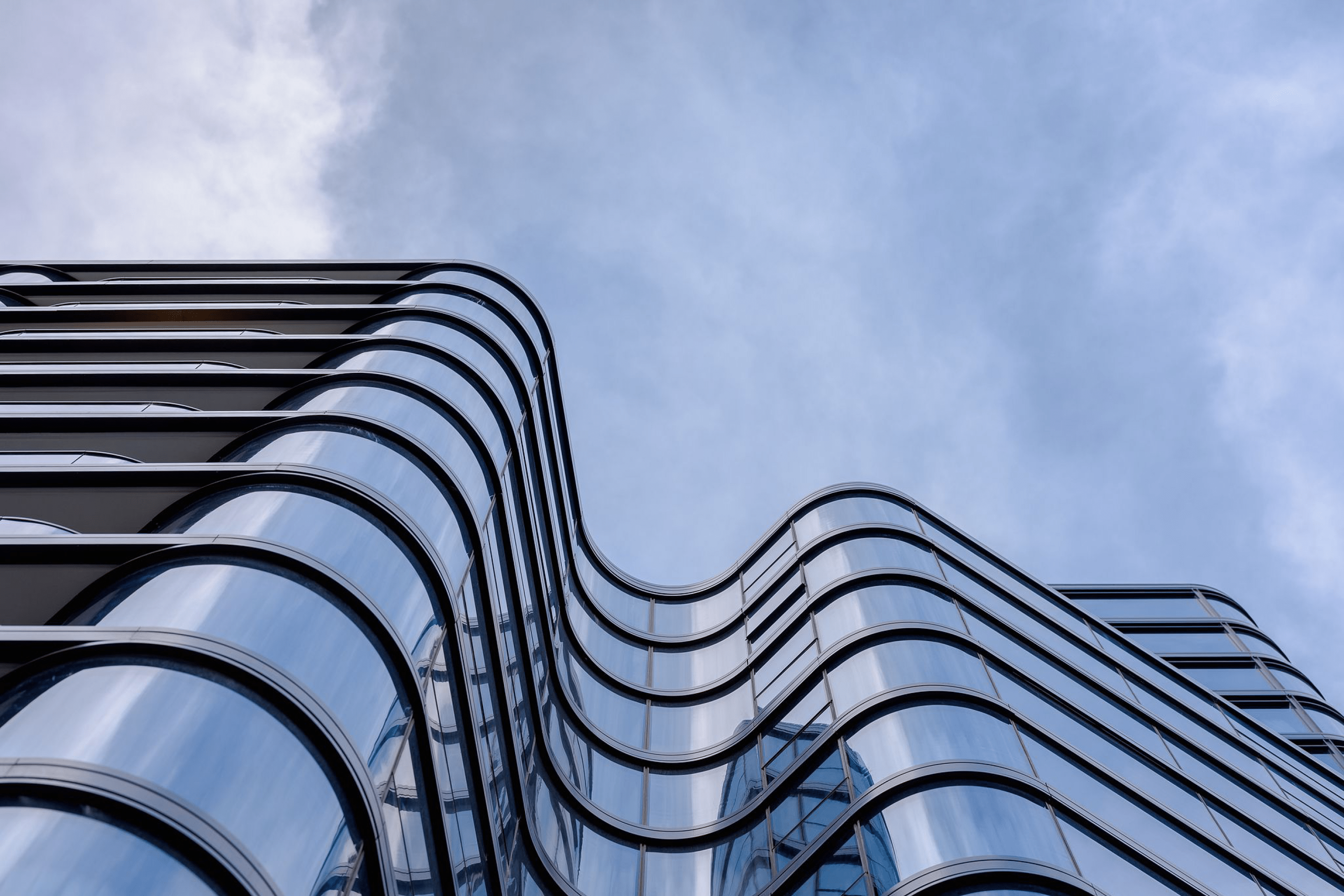 Photograph looking up the fluid façade of Opera Residence designed by Tzannes