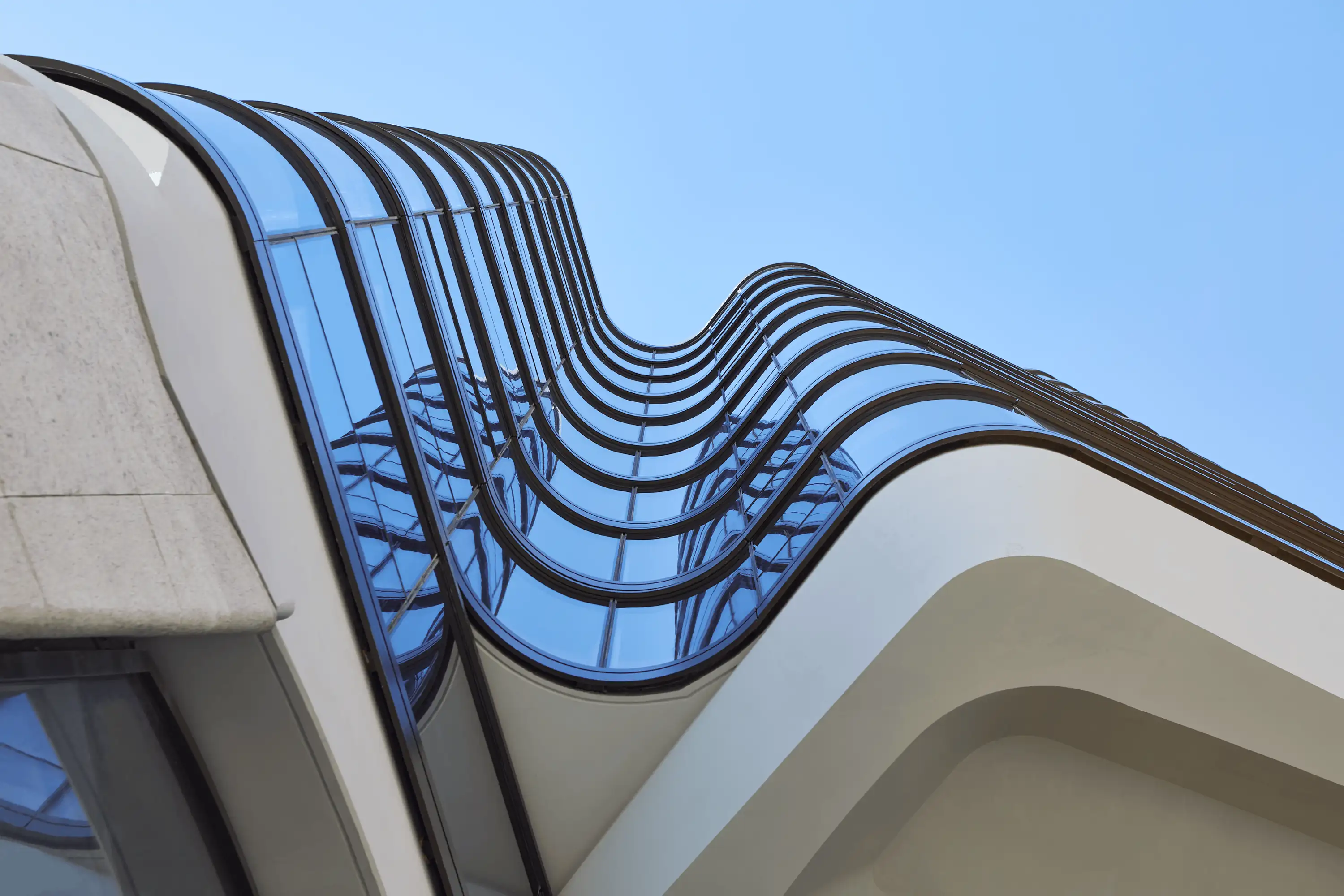 Photograph looking up the fluid façade of Opera Residence designed by Tzannes