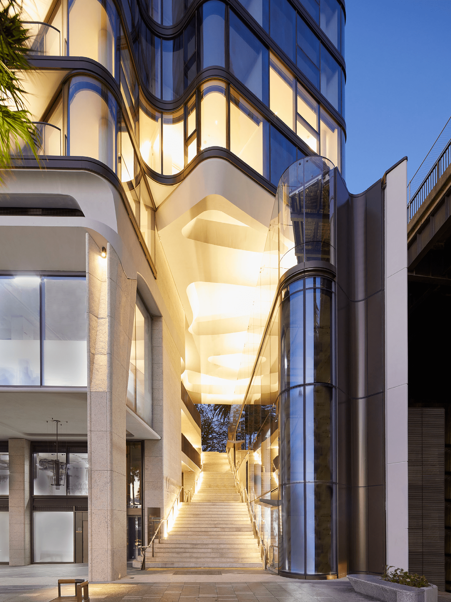 Photograph looking through the public through-site link with sculptural concrete soffit in Opera Residence designed by Tzannes
