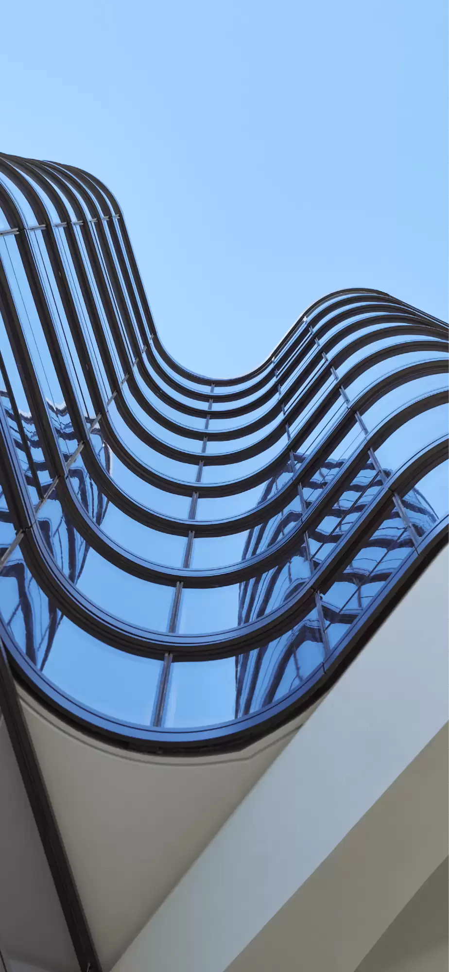 Photograph looking up the fluid façade of Opera Residence designed by Tzannes