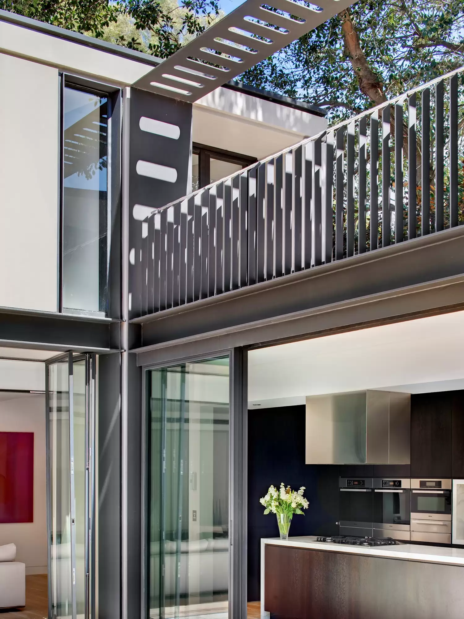 Photograph of balcony on top of kitchen space in the Paddington Corner House designed by Tzannes