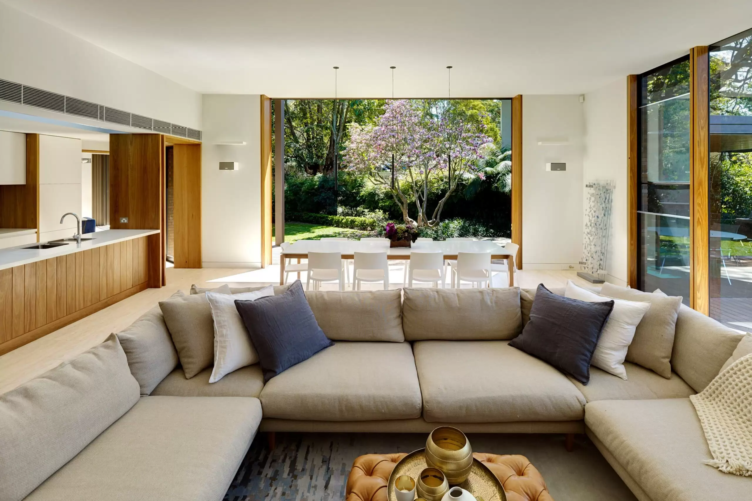 Photograph of the family dining and living spaces in the Garden House designed by Tzannes