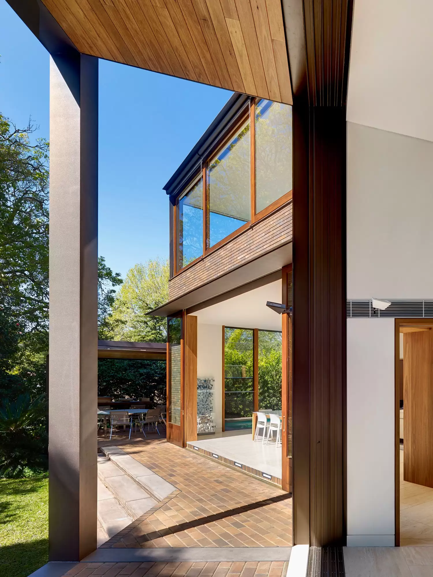 Photograph looking to dining space from verandah in the Garden House designed by Tzannes