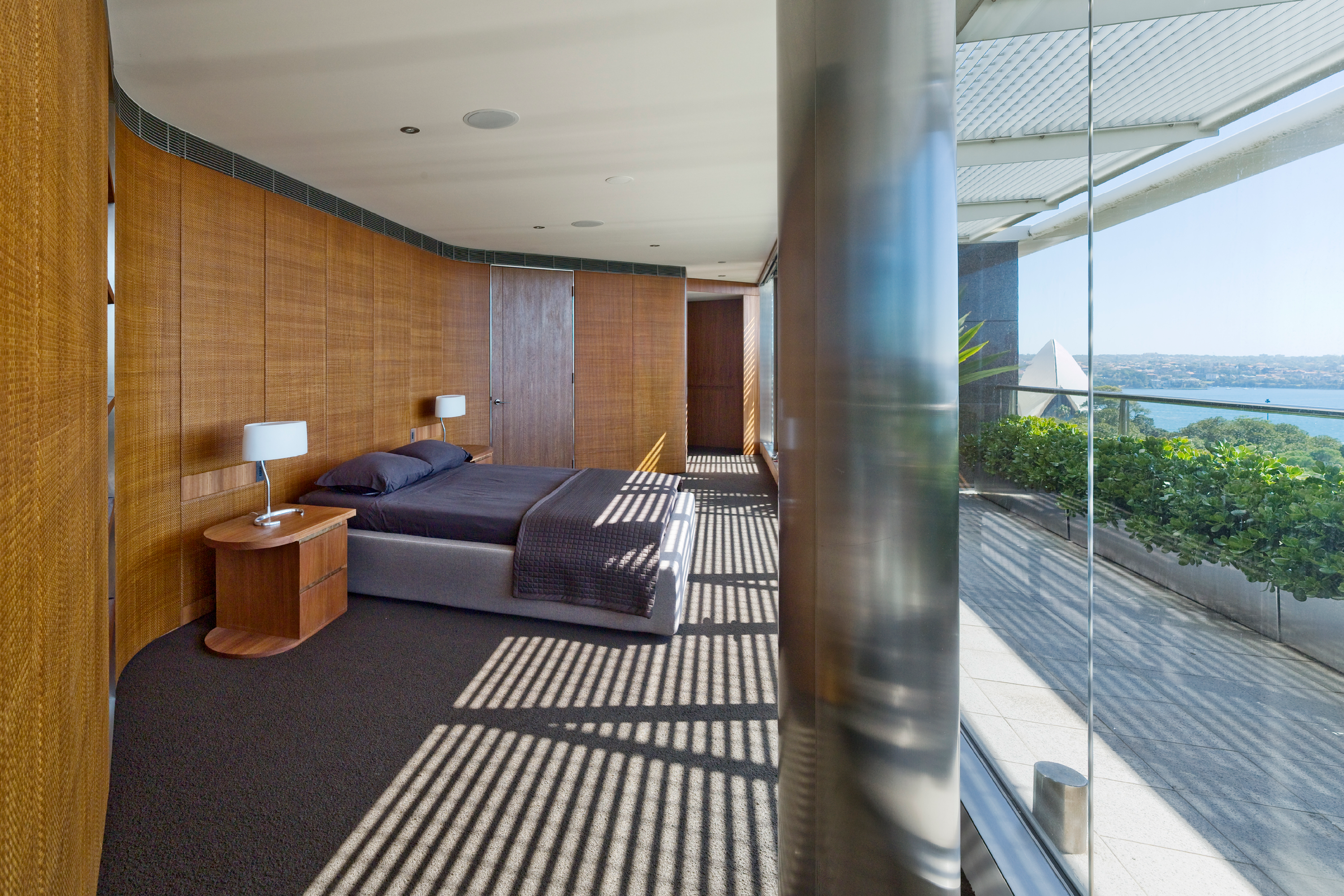 Photograph of bedroom of the award-wining Macquarie Street Apartment (Quay Grand Apartment East Circular Quay) interiors designed by Tzannes